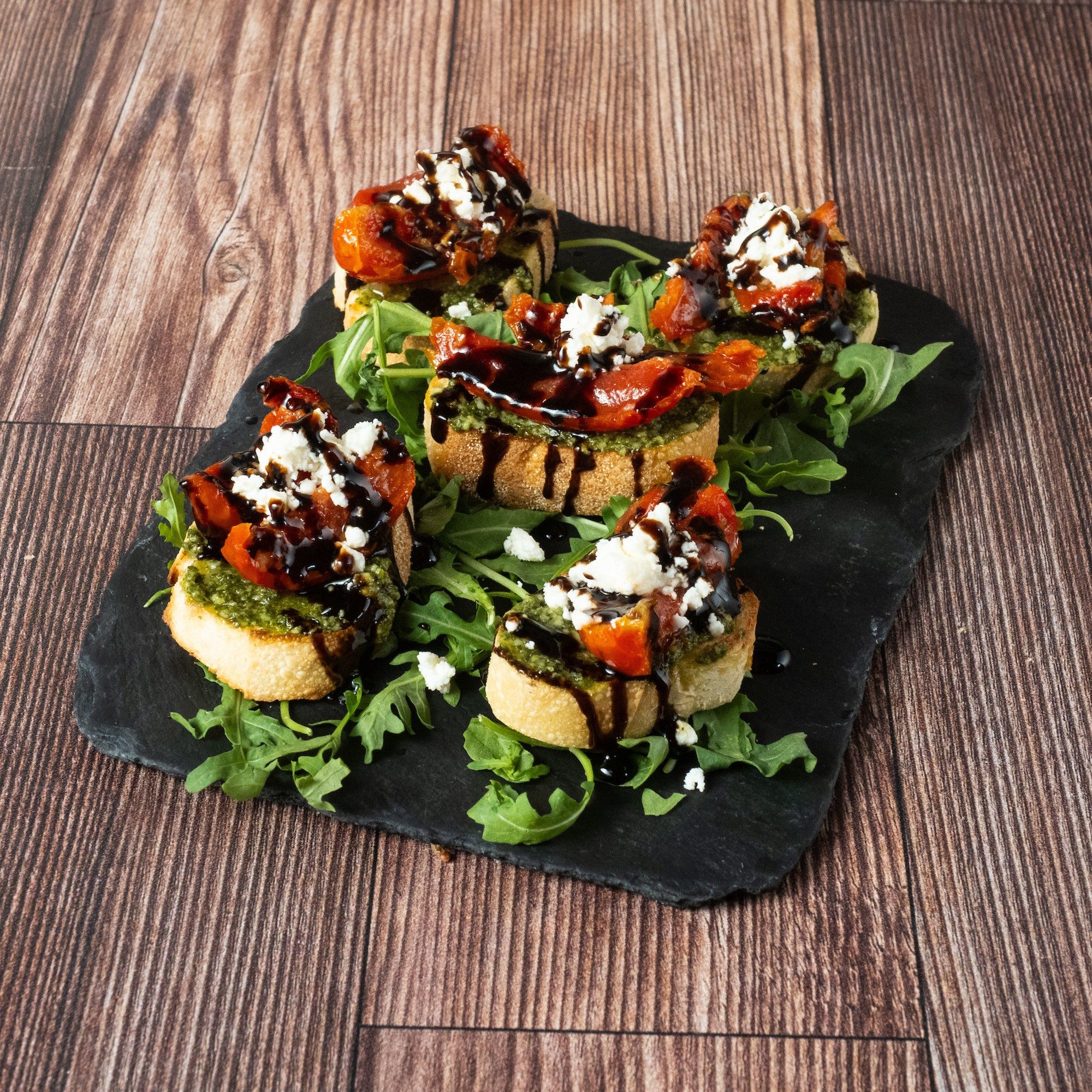 Marinated Tomato and Pesto Crostini
