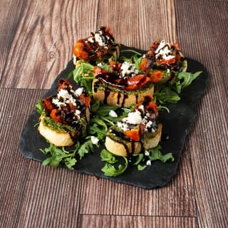 Marinated Tomato and Pesto Crostini